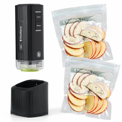 Black FoodSaver Mini FS3100 handheld pump, charging dock and example zipper bags
