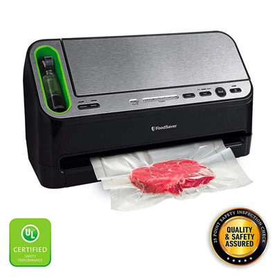 FoodSaver V4440 upright black sealer with silver front panel and tethered handheld fitting